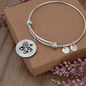 Bangle bracelet with circle pendant and quote Dream Big, stainless steel